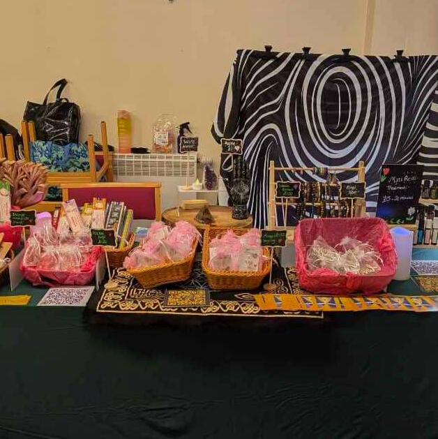 Photo of Becky Golden Light and Emma's stall at the 6th Brianna Ghey Legacy Project Fair in Birchwood.